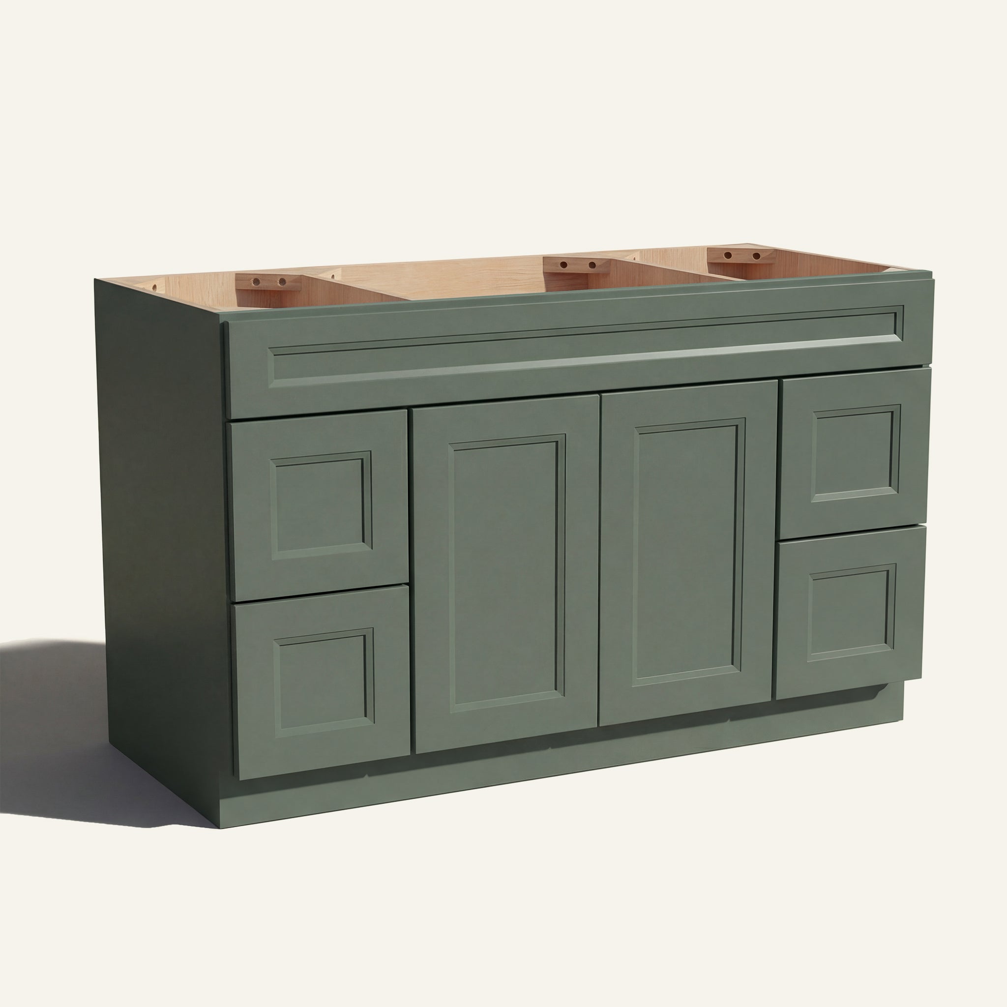 Angled view of a green Belmont beveled Shaker wide single sink vanity base with 2 doors, 4 drawers, and 1 false drawer front.
