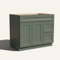 Angled view of green Belmont beveled Shaker single sink vanity, 2 doors, 2 drawers right, and 1 false drawer front.