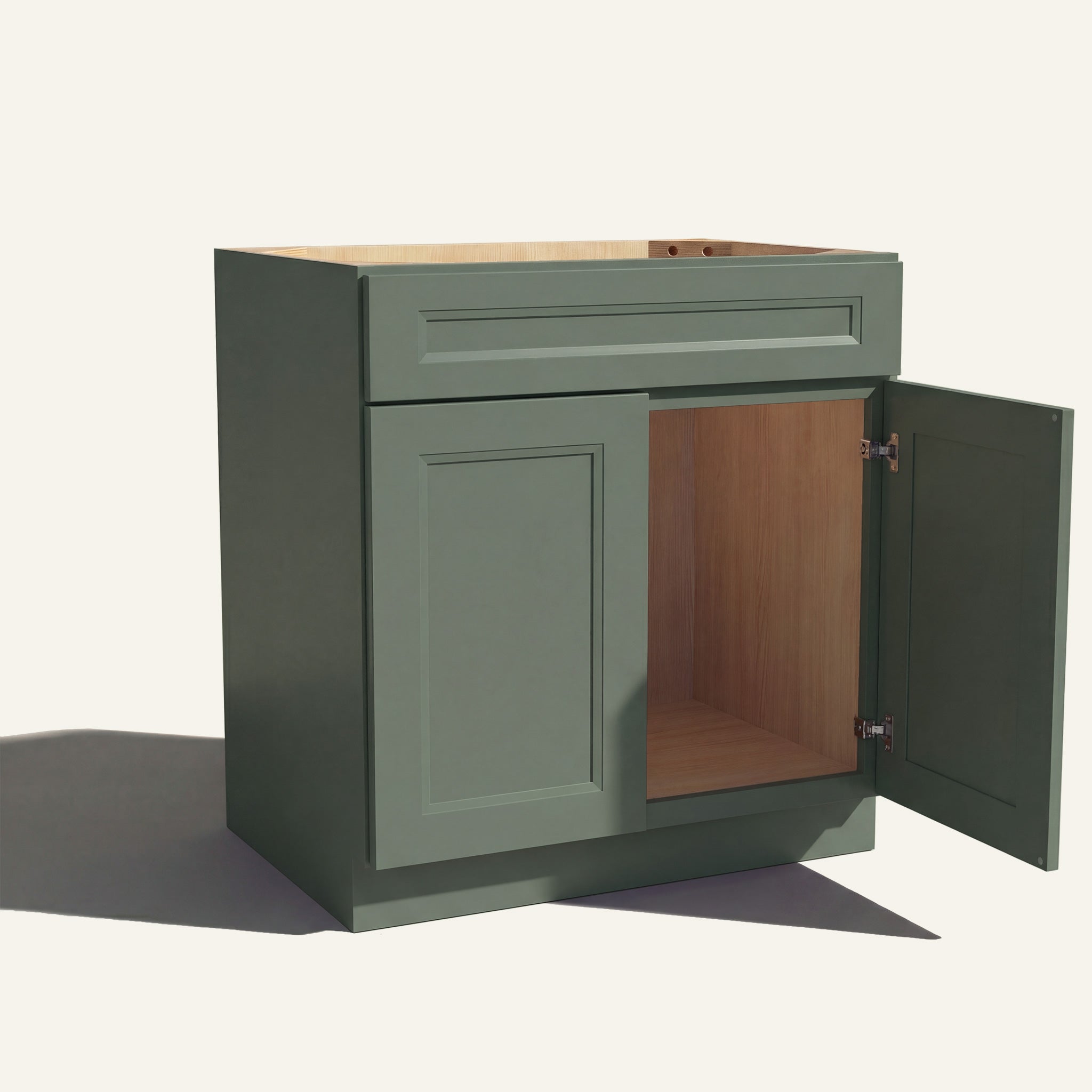 Angled view of green Belmont beveled Shaker single sink vanity, 1 false front, 2 doors with right one open to a wood interior.