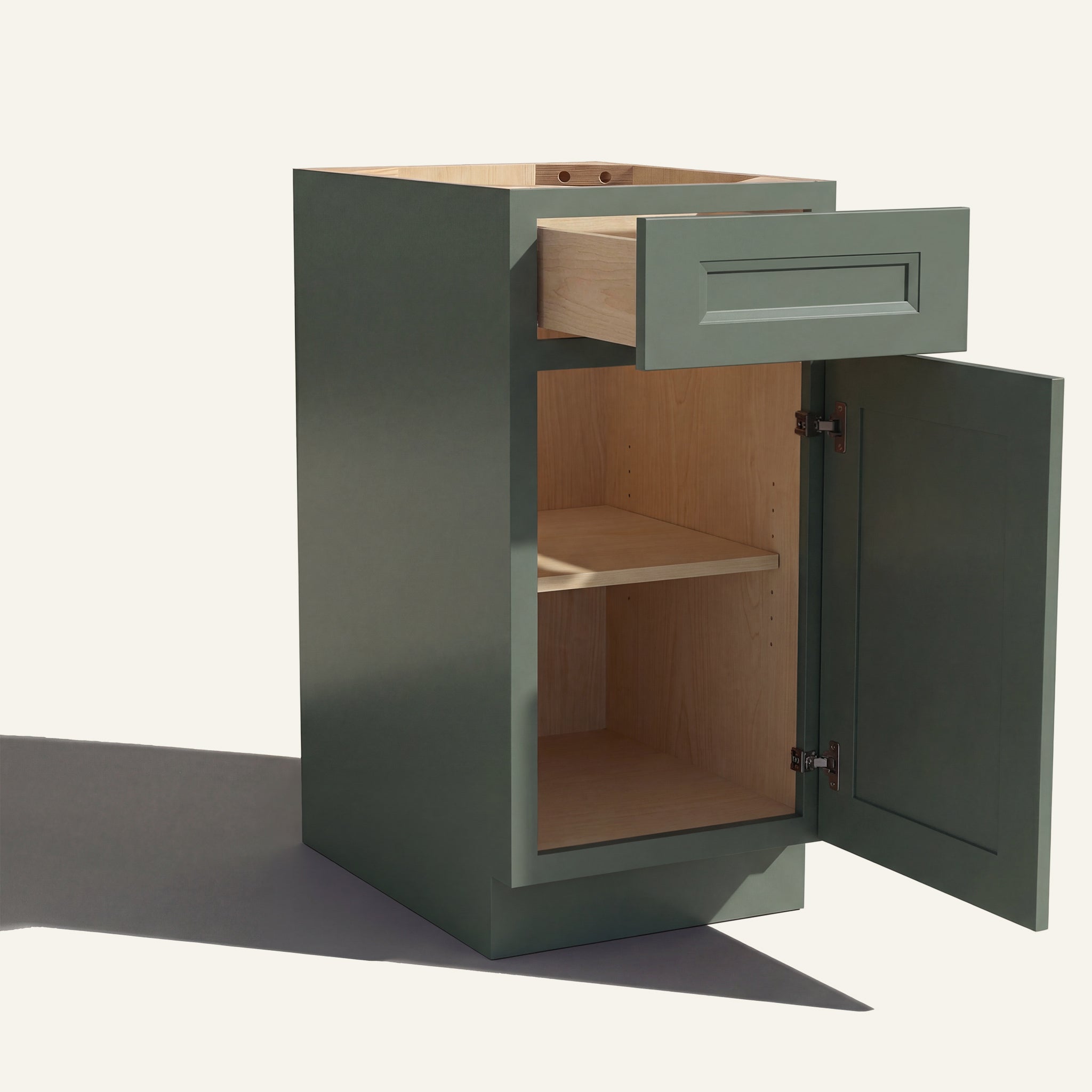 Angled view of a green Belmont beveled Shaker vanity base cabinet with 1 door and 1 drawer open showing wood interior.