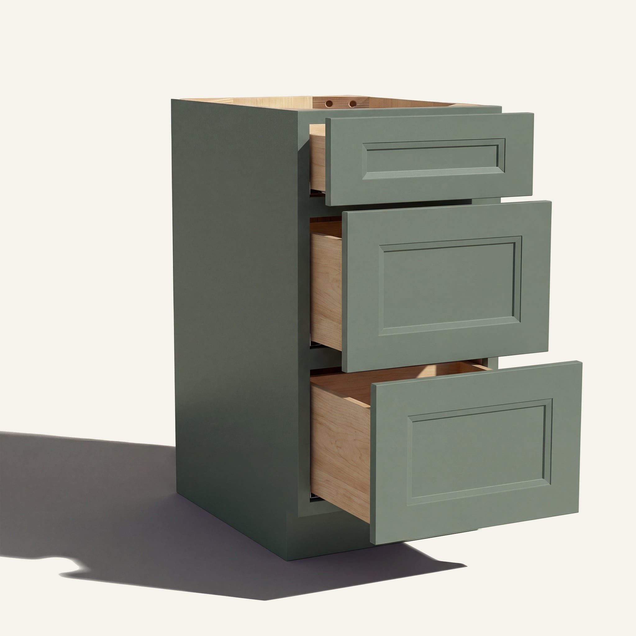 Angled view of a green Belmont beveled Shaker 3-drawer vanity base cabinet with drawers open showing solid wood drawer boxes.