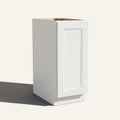 Angled view of a white Belmont beveled Shaker base cabinet with 1 full-height door.