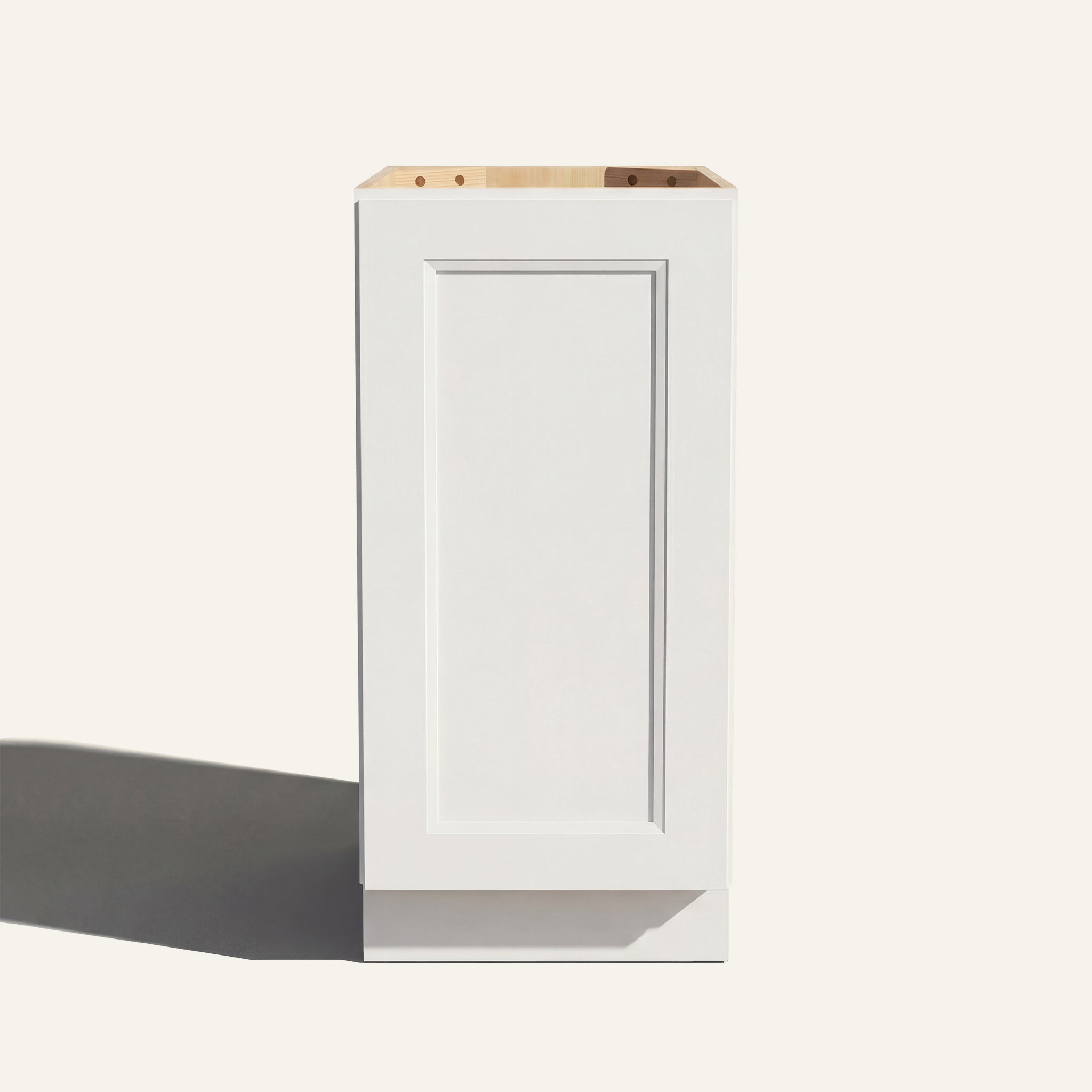 Straight on view of a white Belmont beveled Shaker base cabinet with 1 full-height door.