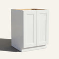 Angled view of a white Belmont beveled Shaker base cabinet with 2 full height doors.
