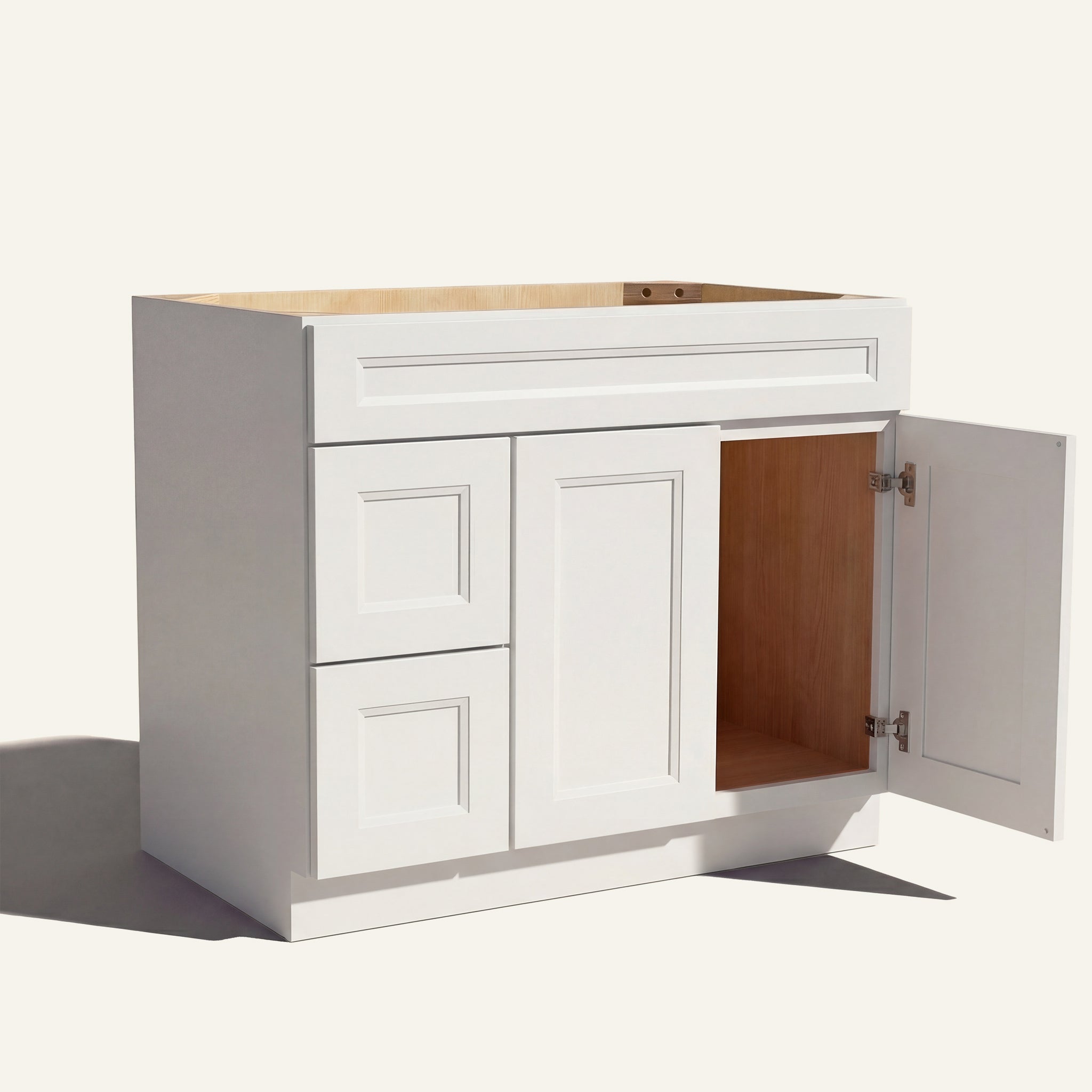 Open right door view of a white Belmont beveled shaker single sink vanity featuring two doors and 2 left-side stacked drawers.