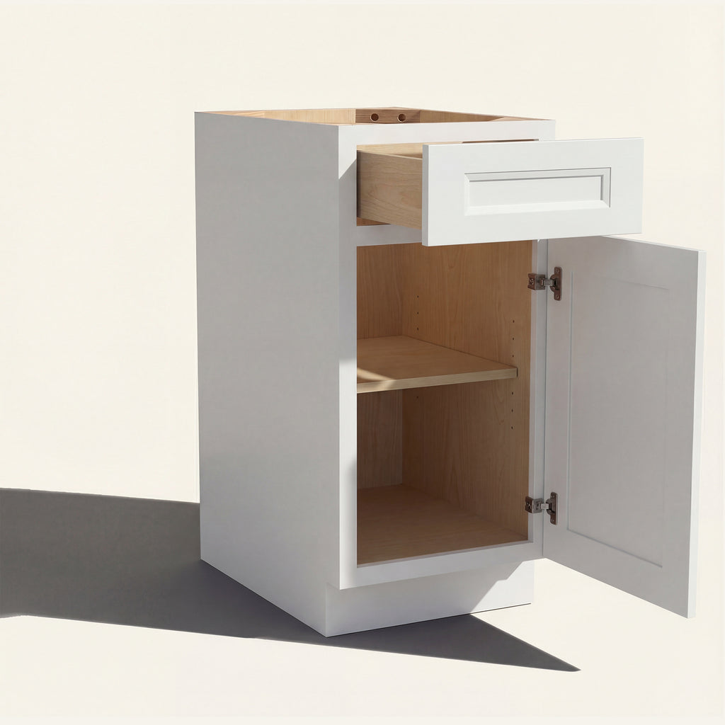 Angled view of a white Belmont beveled Shaker vanity base cabinet with 1 door and 1 drawer open showing wood interior.