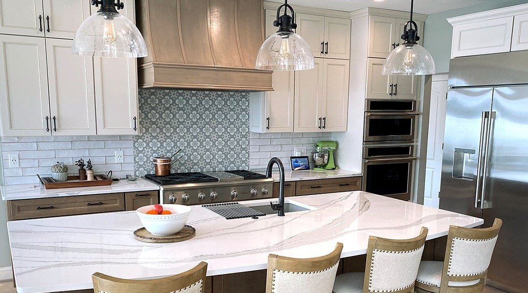 Kitchen with a sloped style wood range hood