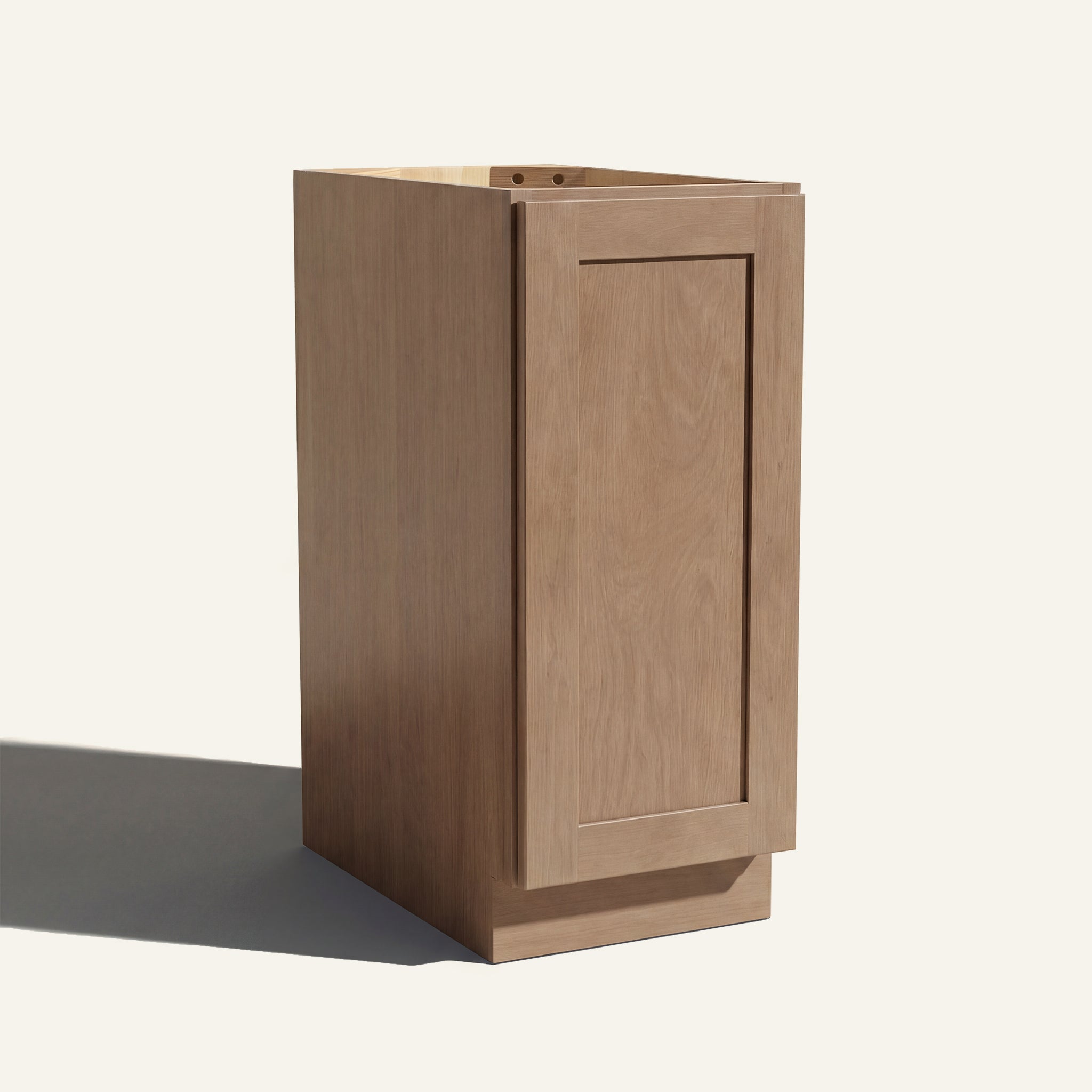 Angled view of a driftwood Seaport Shaker base cabinet with 1 full-height door.