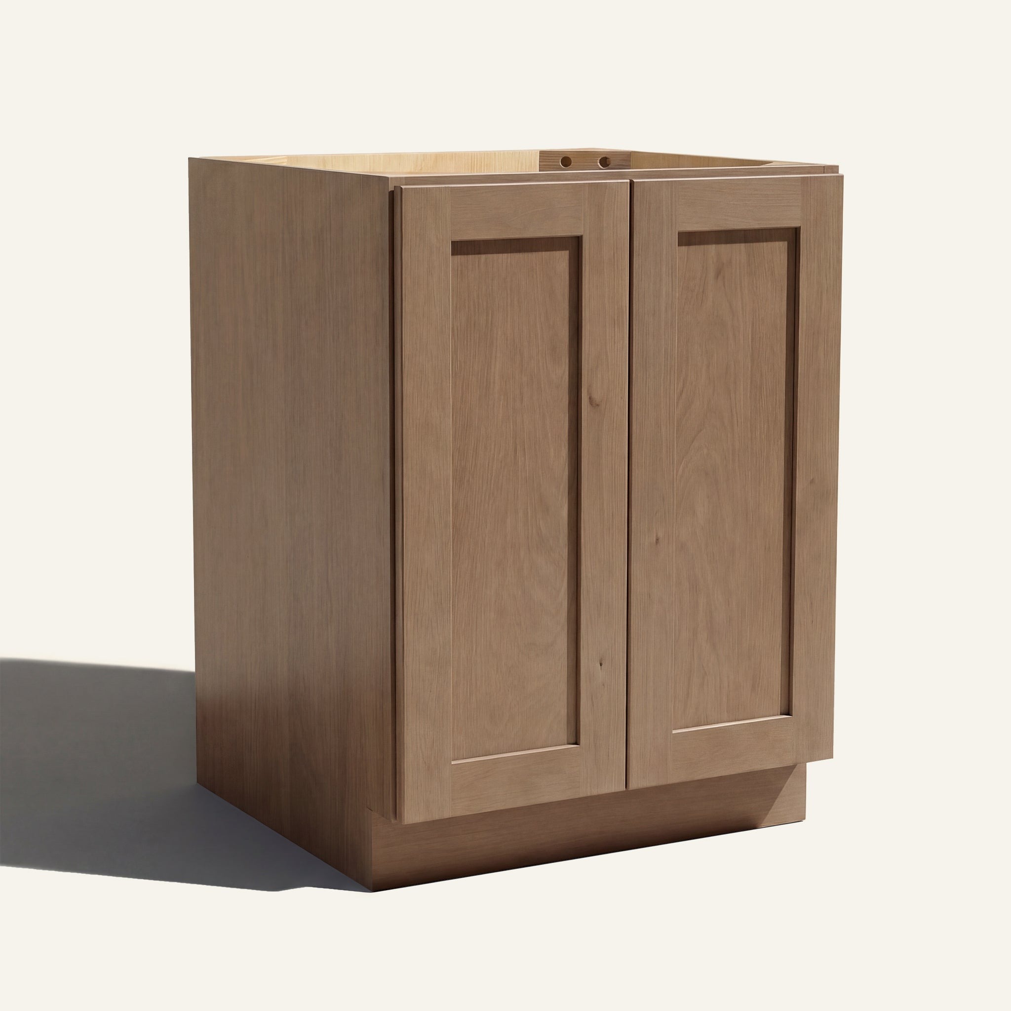 Angled view of a driftwood Seaport Shaker base cabinet with 2 full height doors.