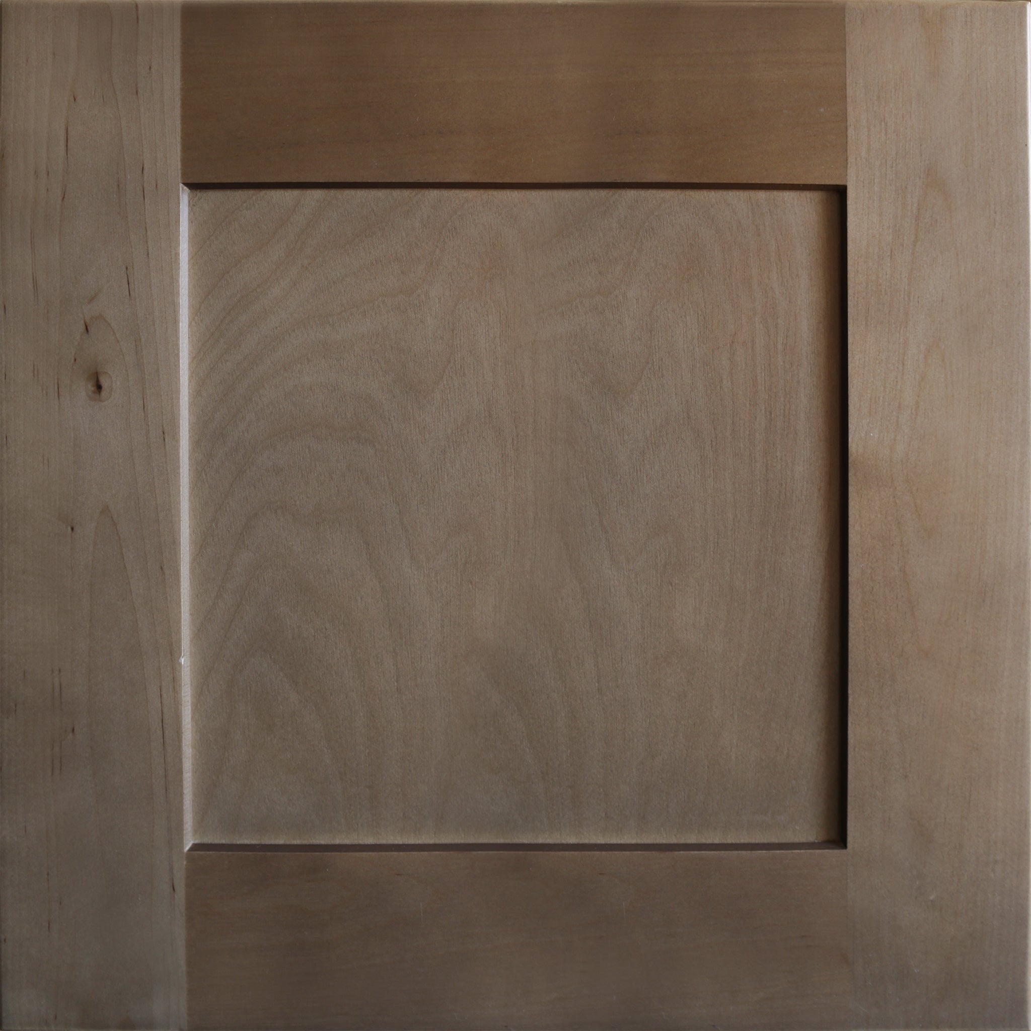 Close up view of a medium brown satin stain on a birch wood Seaport shaker cabinet door with a recessed square panel.