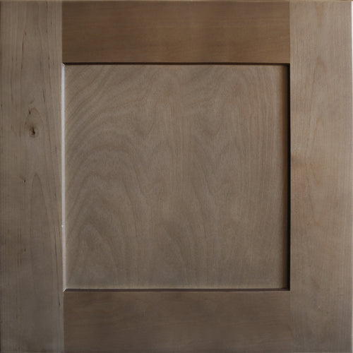 Close up view of a medium brown satin stain on a birch wood Seaport shaker cabinet door with a recessed square panel.