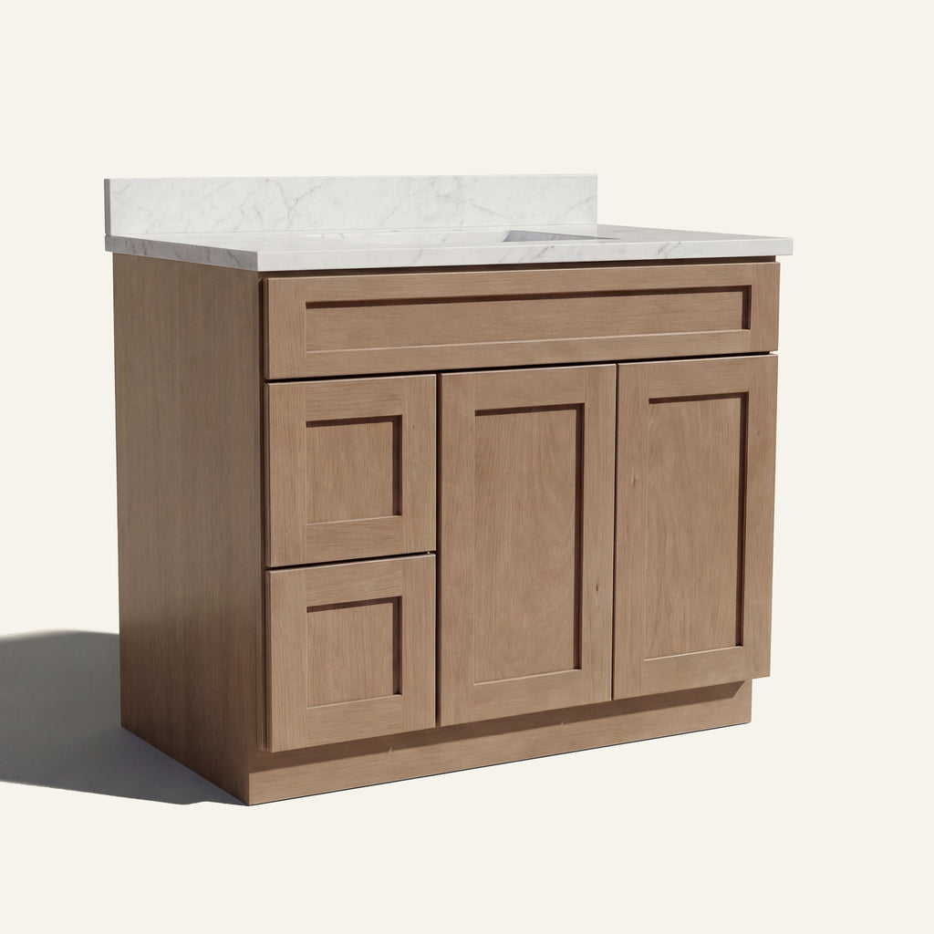 Angled view of a driftwood Seaport shaker single sink vanity featuring two doors and a left-side drawer bank.