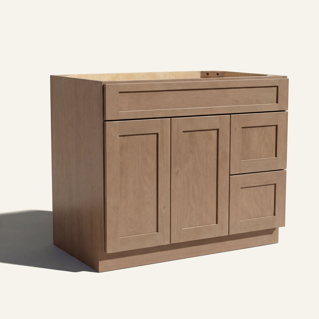 Angled view of driftwood Seaport Shaker single sink vanity, 2 doors, 2 drawers right, and 1 false drawer front.