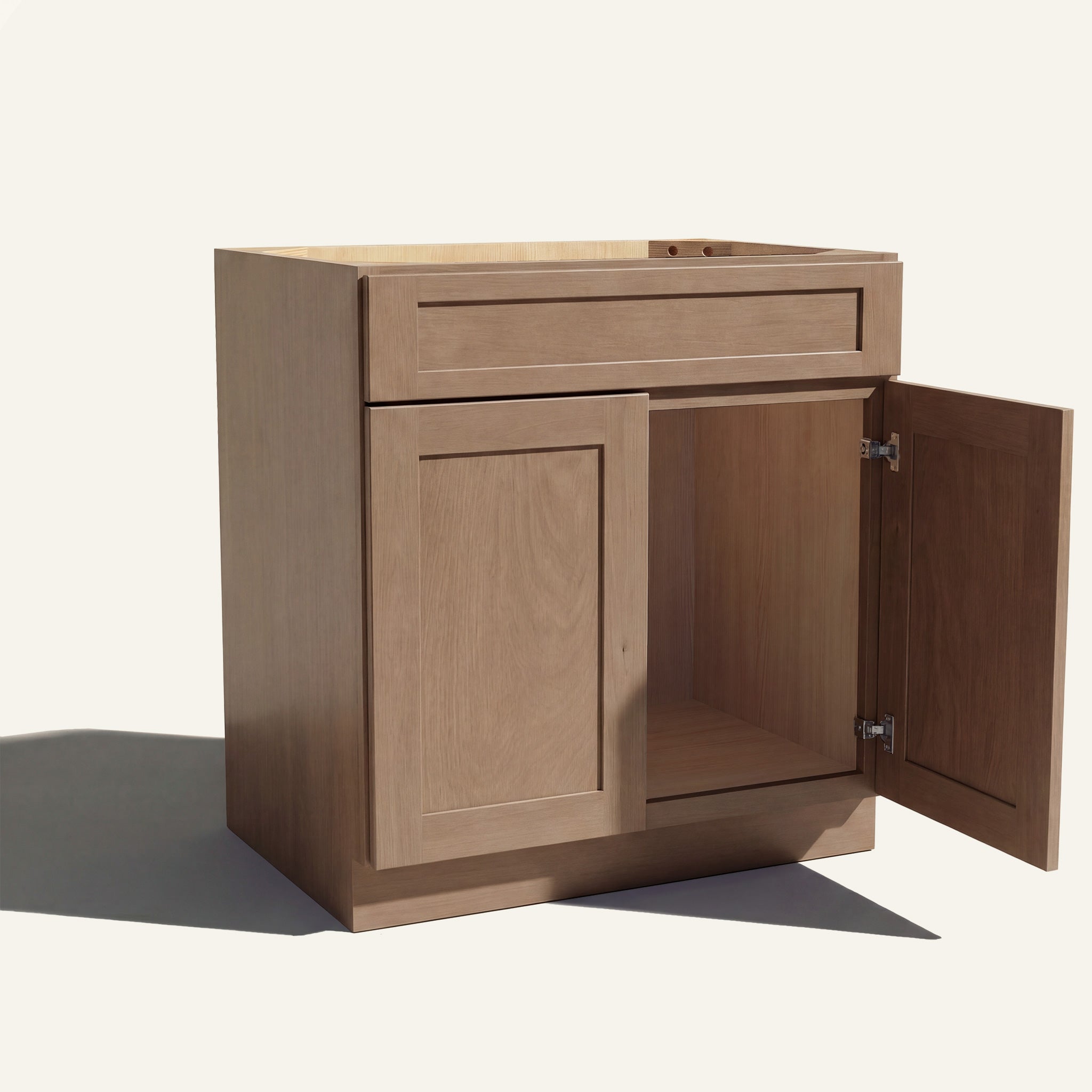 Angled view of driftwood Seaport Shaker single sink vanity, 1 false front, 2 doors with right one open to a wood interior.