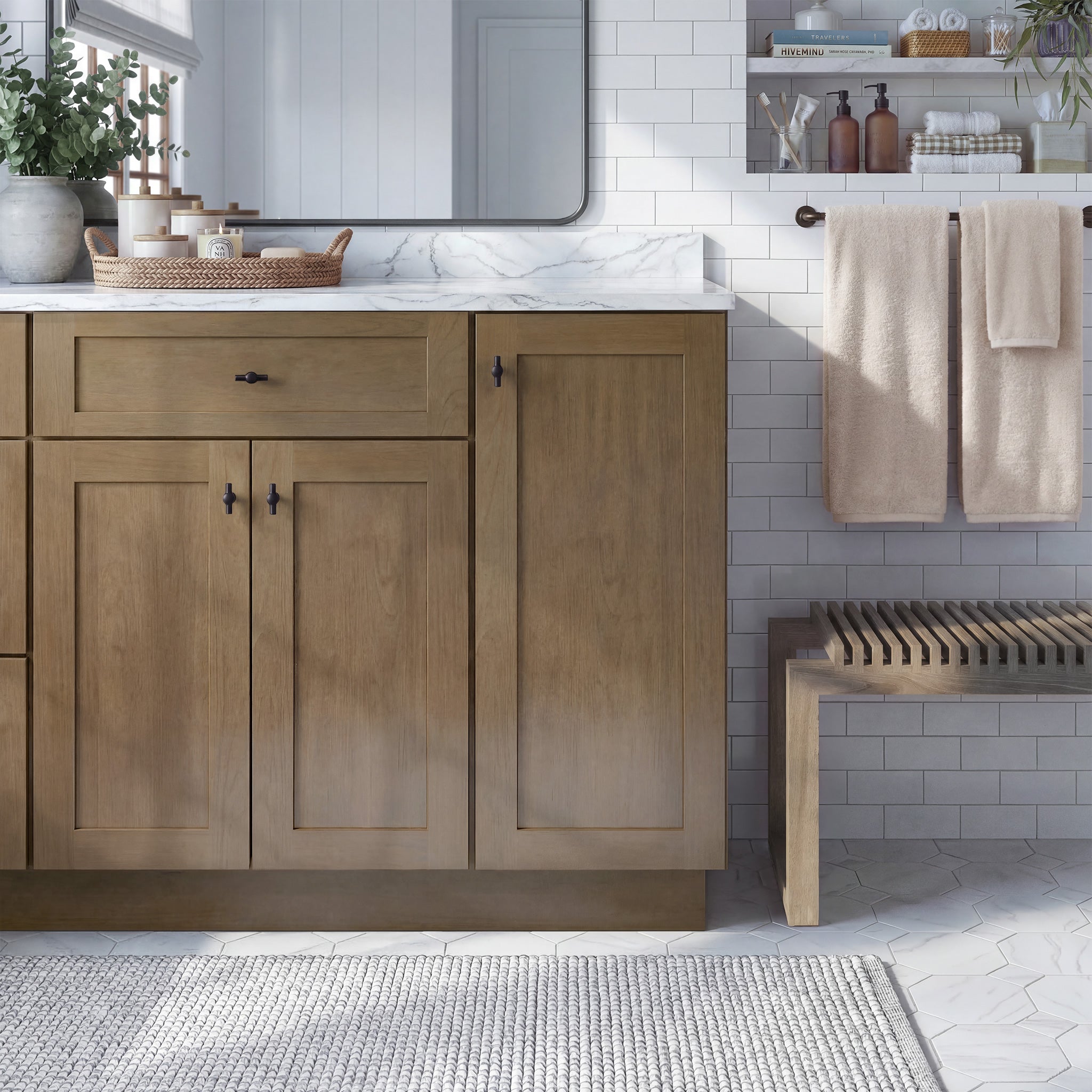 Front view of a driftwood Seaport traditional vanity base cabinet with 3 doors and 1 drawer in a styled bathroom.