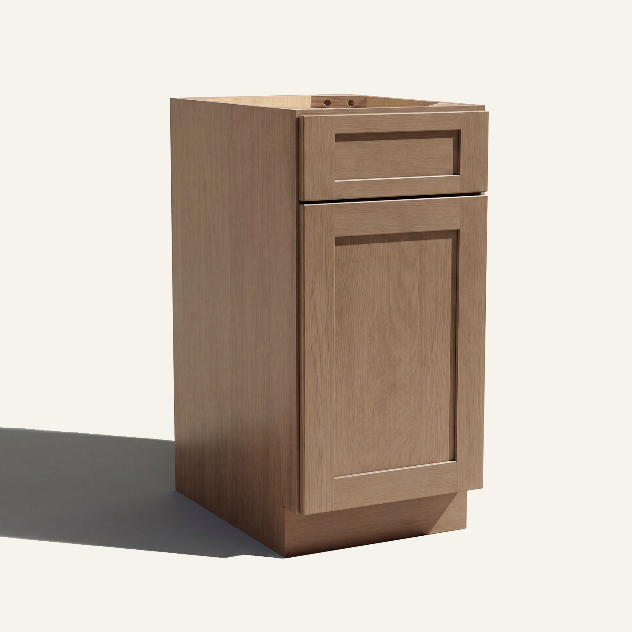 Angled view of a driftwood Seaport Shaker vanity base cabinet with 1 door and 1 drawer.