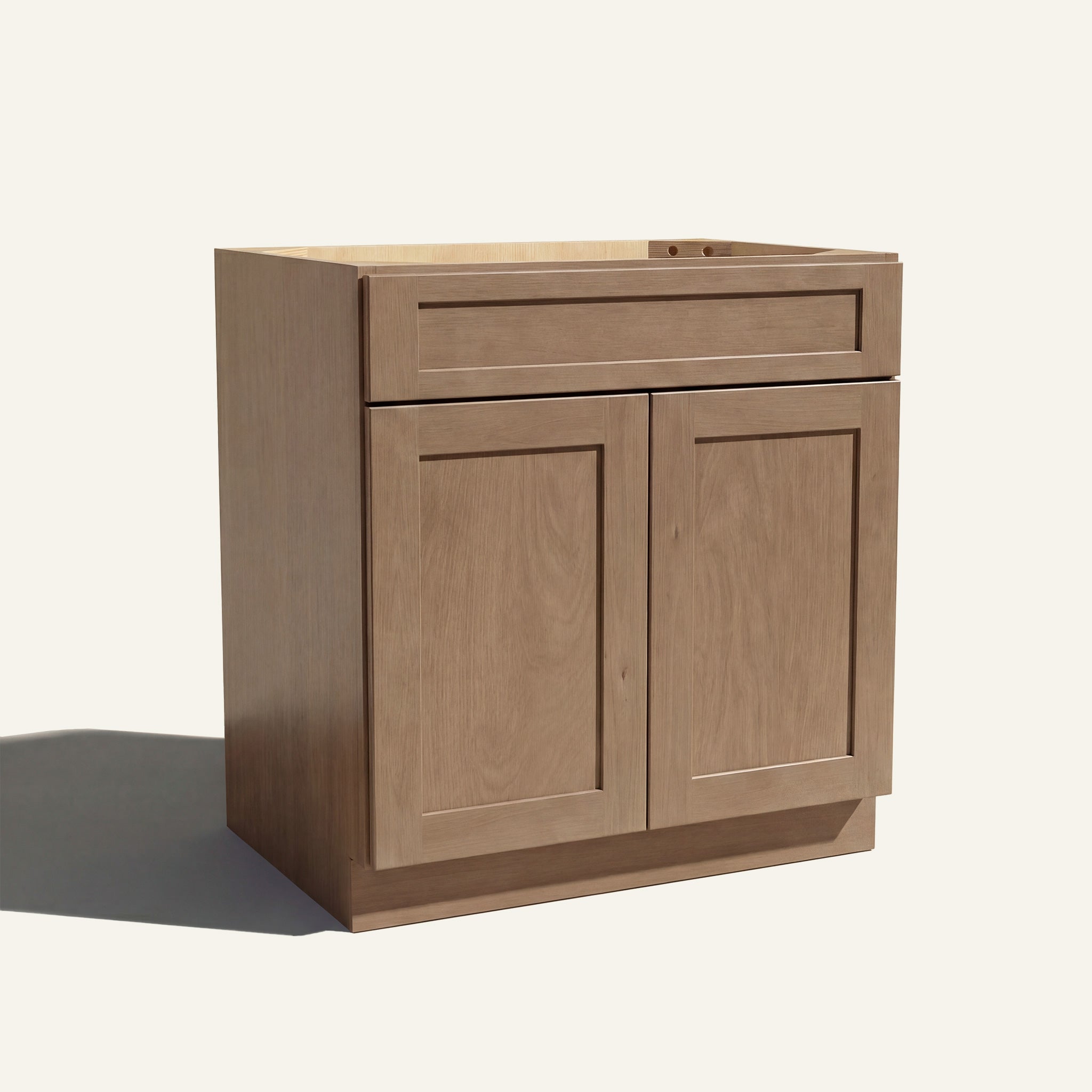 Angled view of a driftwood Seaport shaker double door vanity base with 2 doors and 1 drawer.