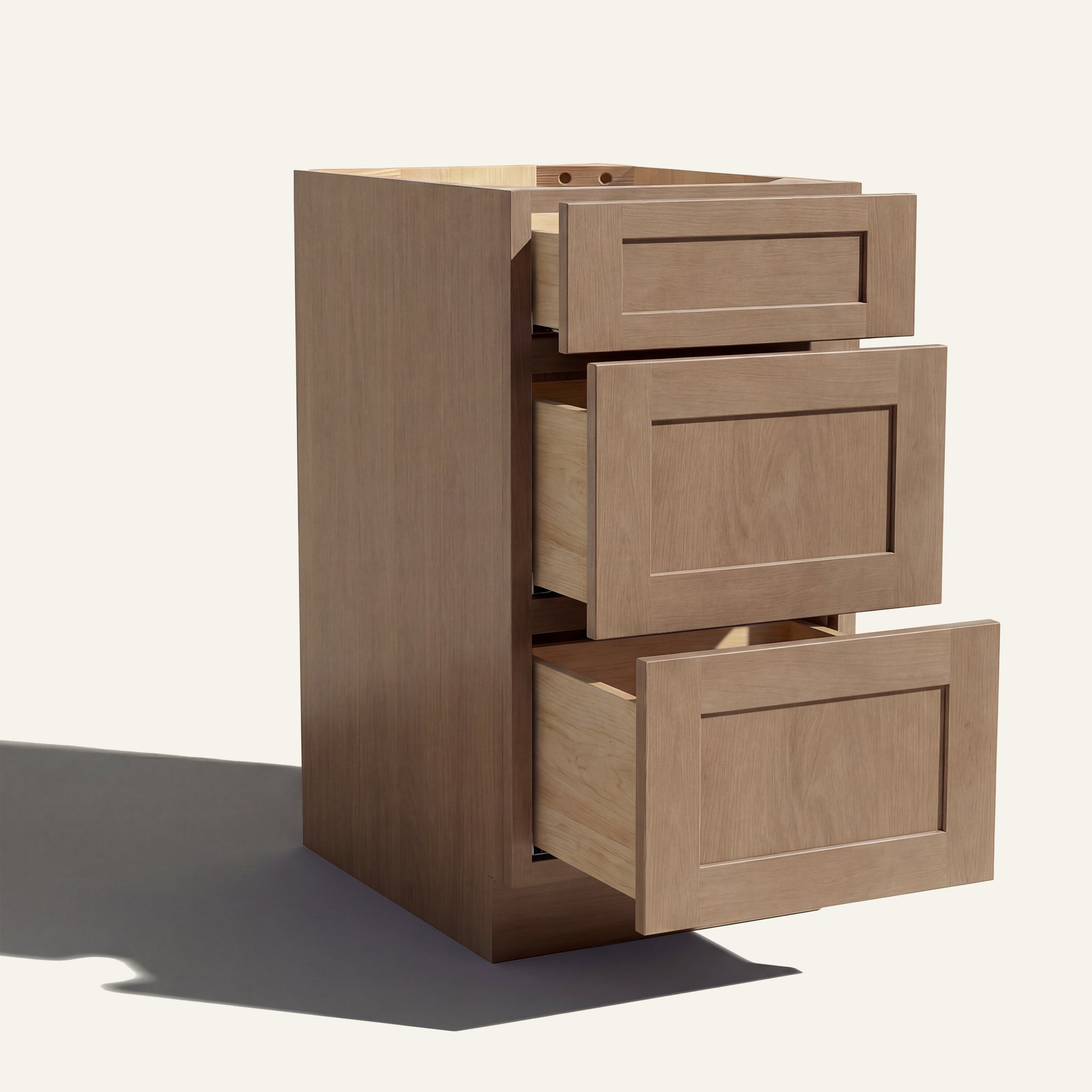 Angled view of a driftwood Seaport Shaker 3-drawer vanity base cabinet with drawers open showing solid wood drawer boxes.