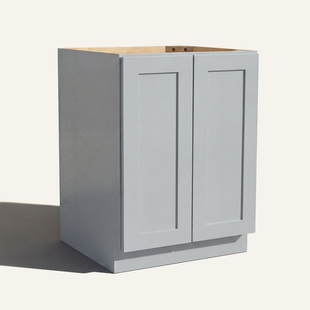 Angled view of a light gray Seaport Shaker base cabinet with 2 full height doors.