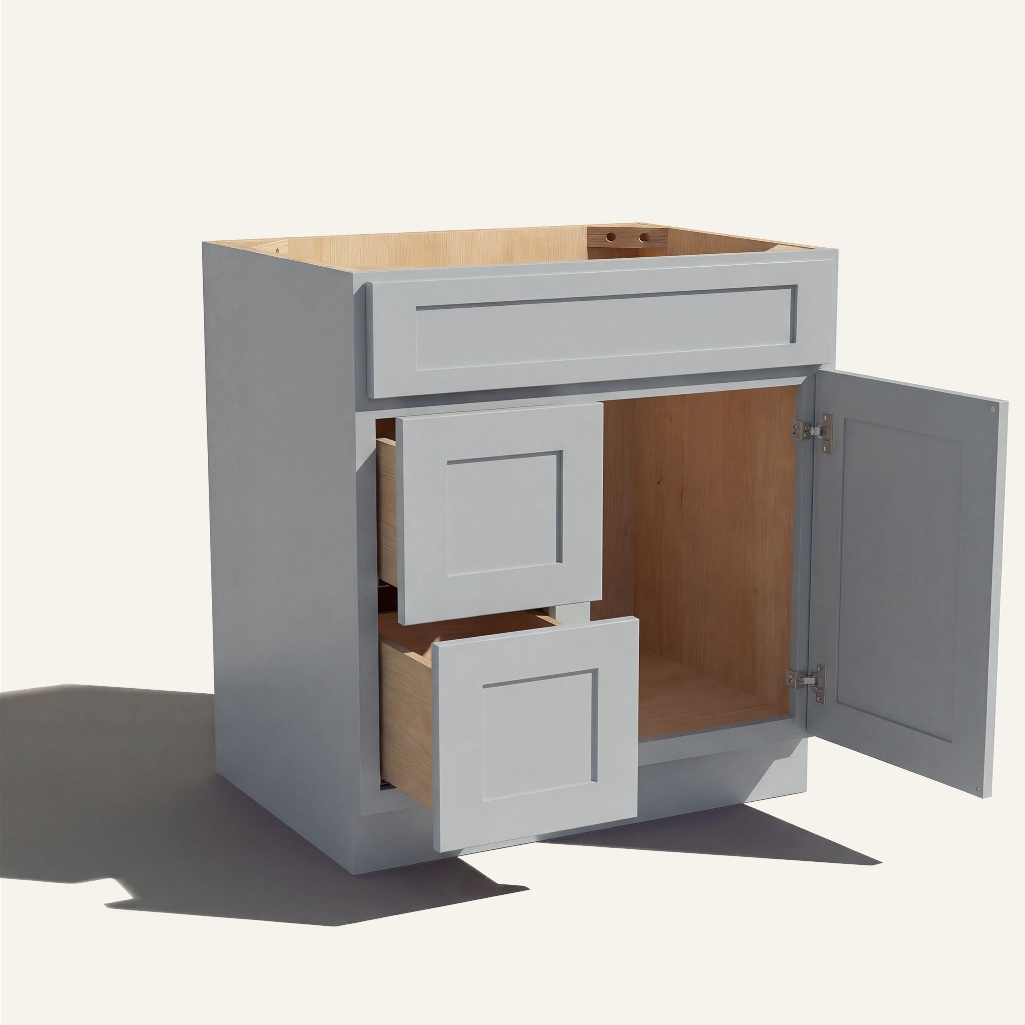 Open view of a light gray Seaport shaker single sink vanity with 1 door and 2 drawers on the left.