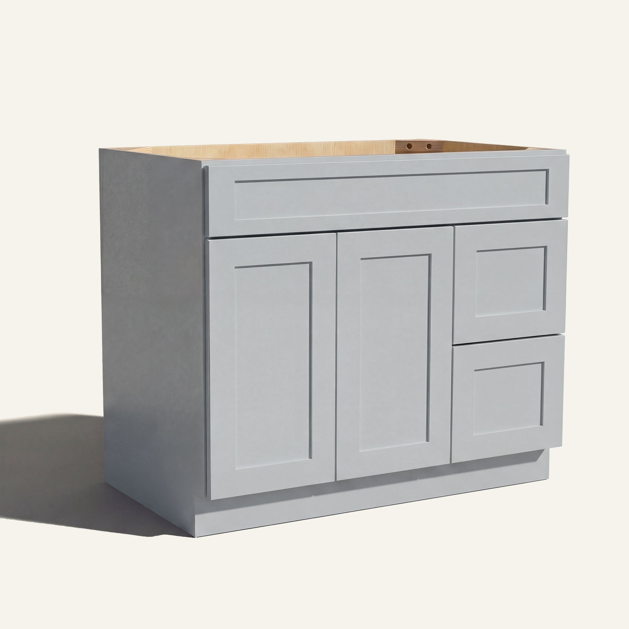 Angled view of light gray Seaport Shaker single sink vanity, 2 doors, 2 drawers right, and 1 false drawer front.