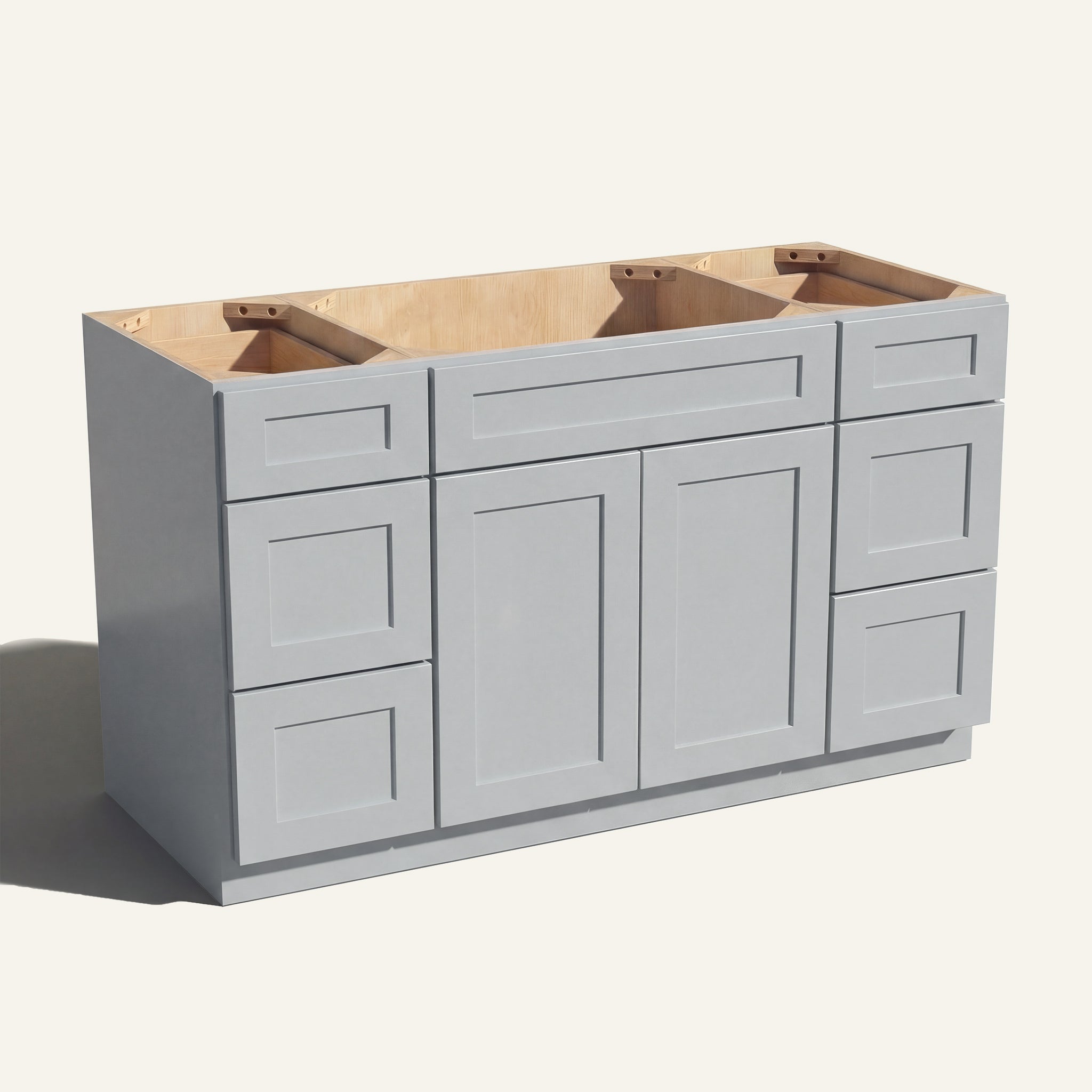 Angled view of a light gray Seaport Shaker 60w single sink vanity with 2 doors, 6 drawers and 1 false drawer front.