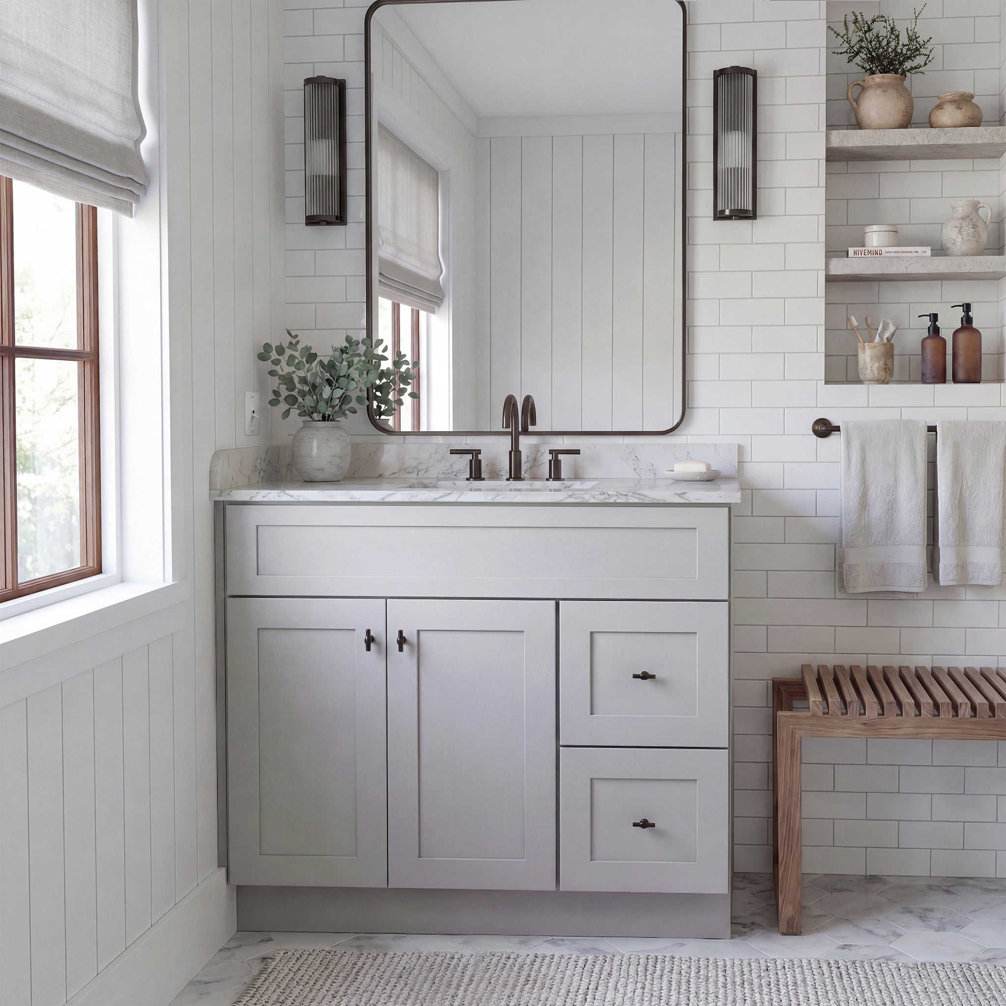 Front view of a light gray Seaport shaker vanity with 2 doors, 2 drawers right, and 1 false drawer in a warm traditional bathroom.
