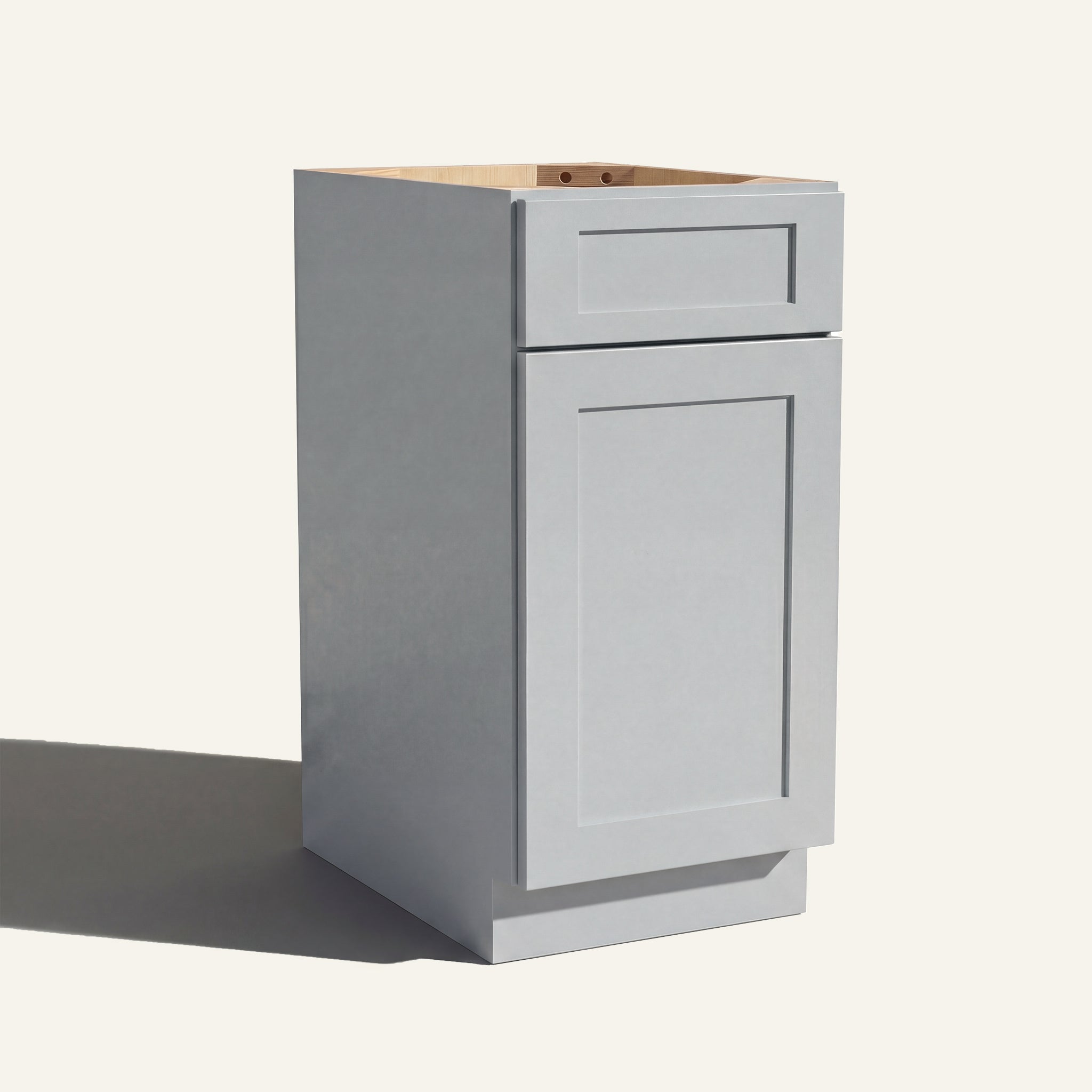 Angled view of a light gray Seaport Shaker vanity base cabinet with 1 door and 1 drawer.