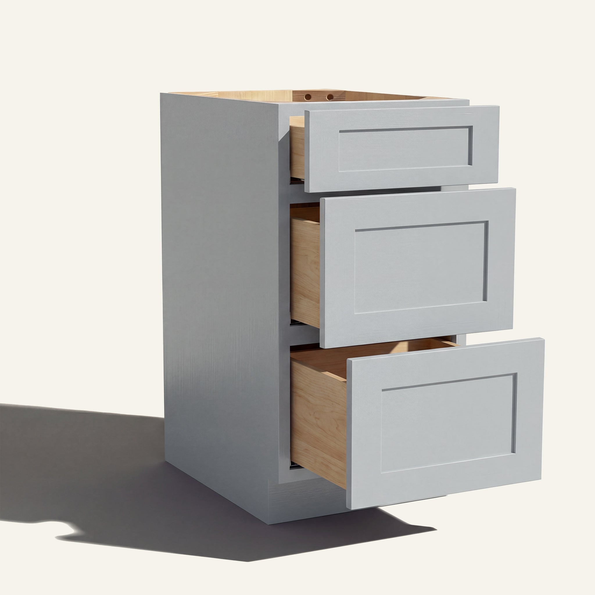 Angled view of a light gray Seaport Shaker 3-drawer vanity base cabinet with drawers open showing solid wood drawer boxes.