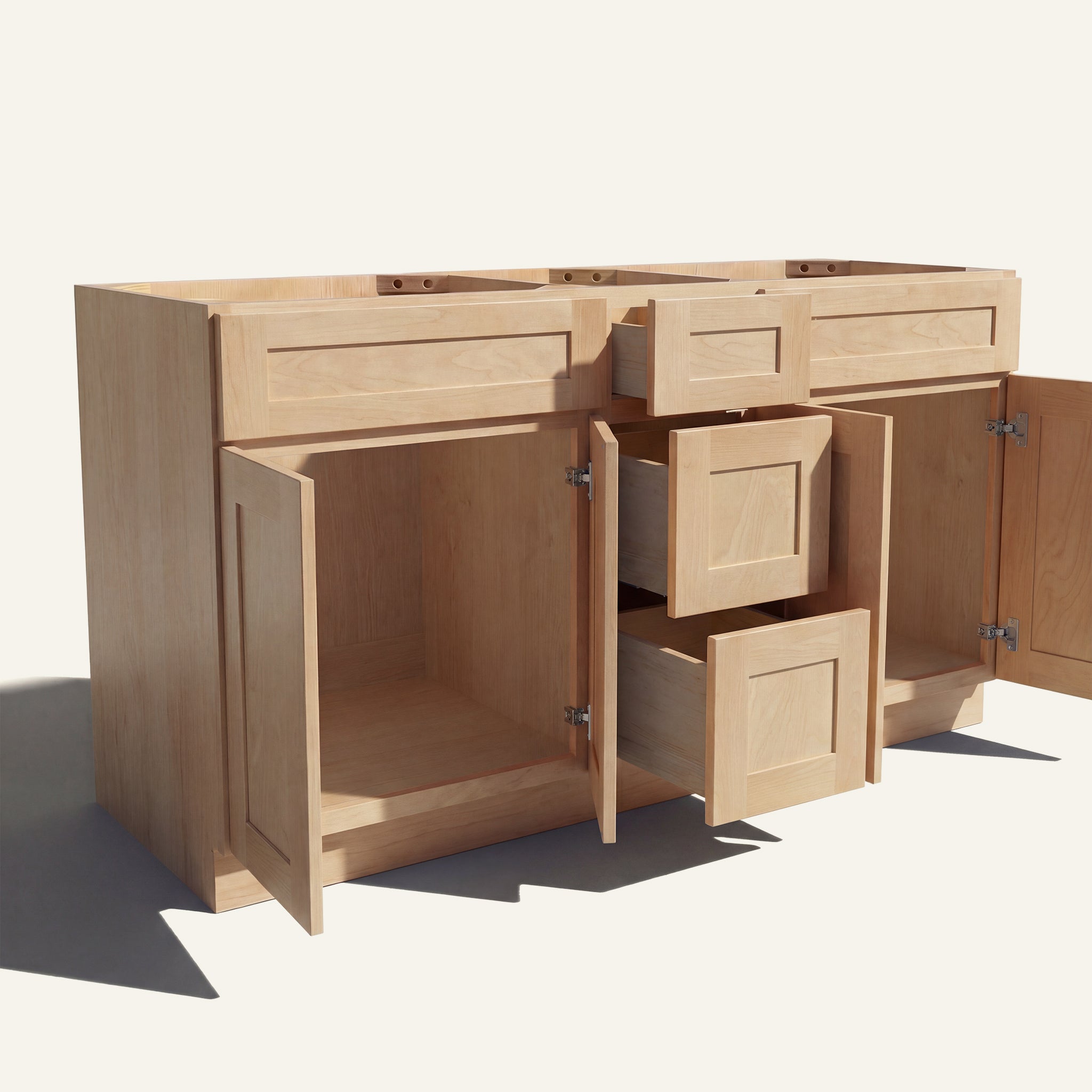 Angled view of a natural Seaport Shaker double sink vanity base with doors and 3 drawers open showing wood interior.