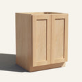 Angled view of a natural Seaport Shaker base cabinet with 2 full height doors.