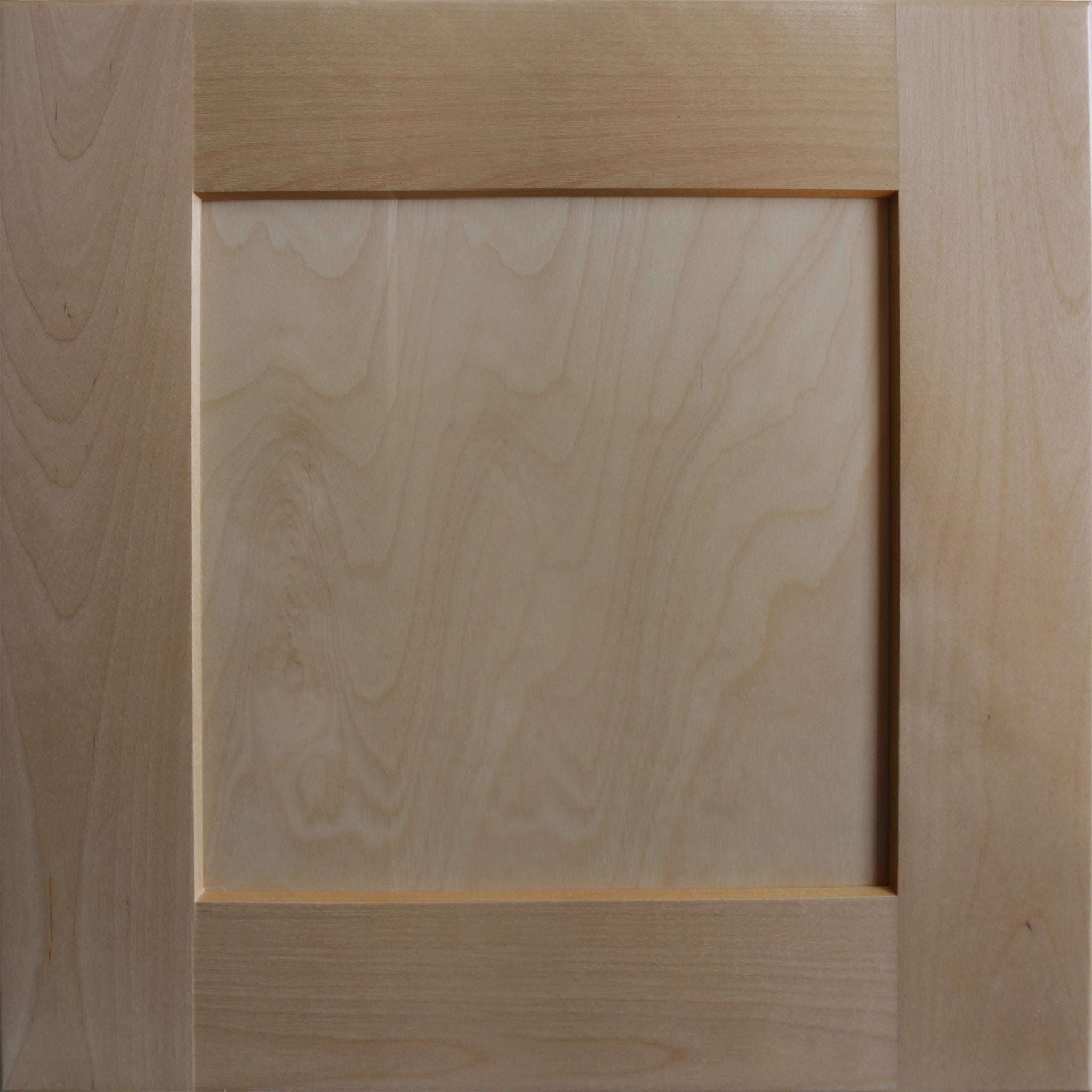 Close up view of a clear satin stain on a birch wood Seaport shaker cabinet door with a recessed square panel.