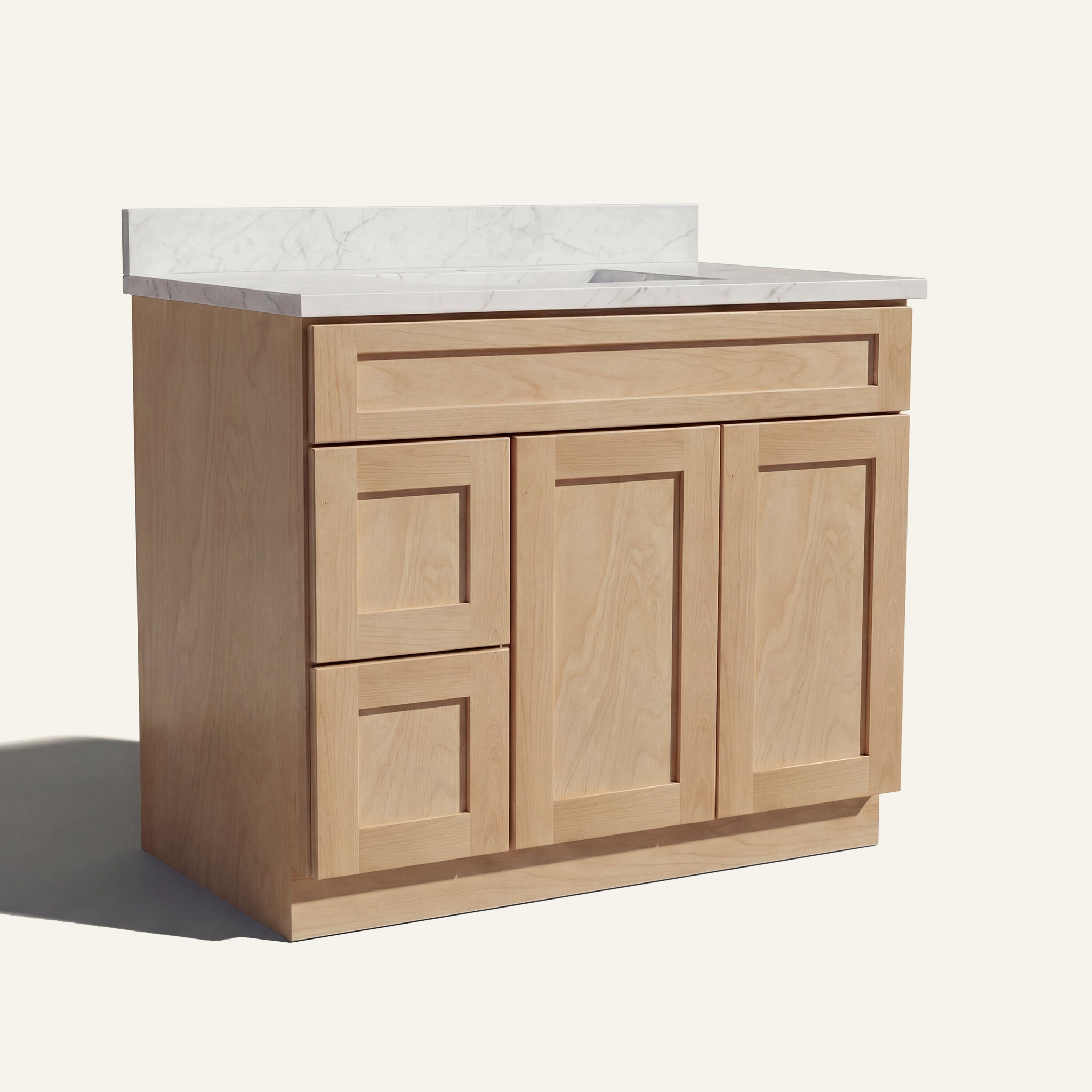 Angled view of a natural Seaport shaker single sink vanity featuring two doors and a left-side drawer bank.