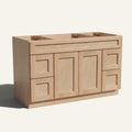 Angled view of a natural Seaport Shaker wide single sink vanity base with 2 doors, 4 drawers, and 1 false drawer front.