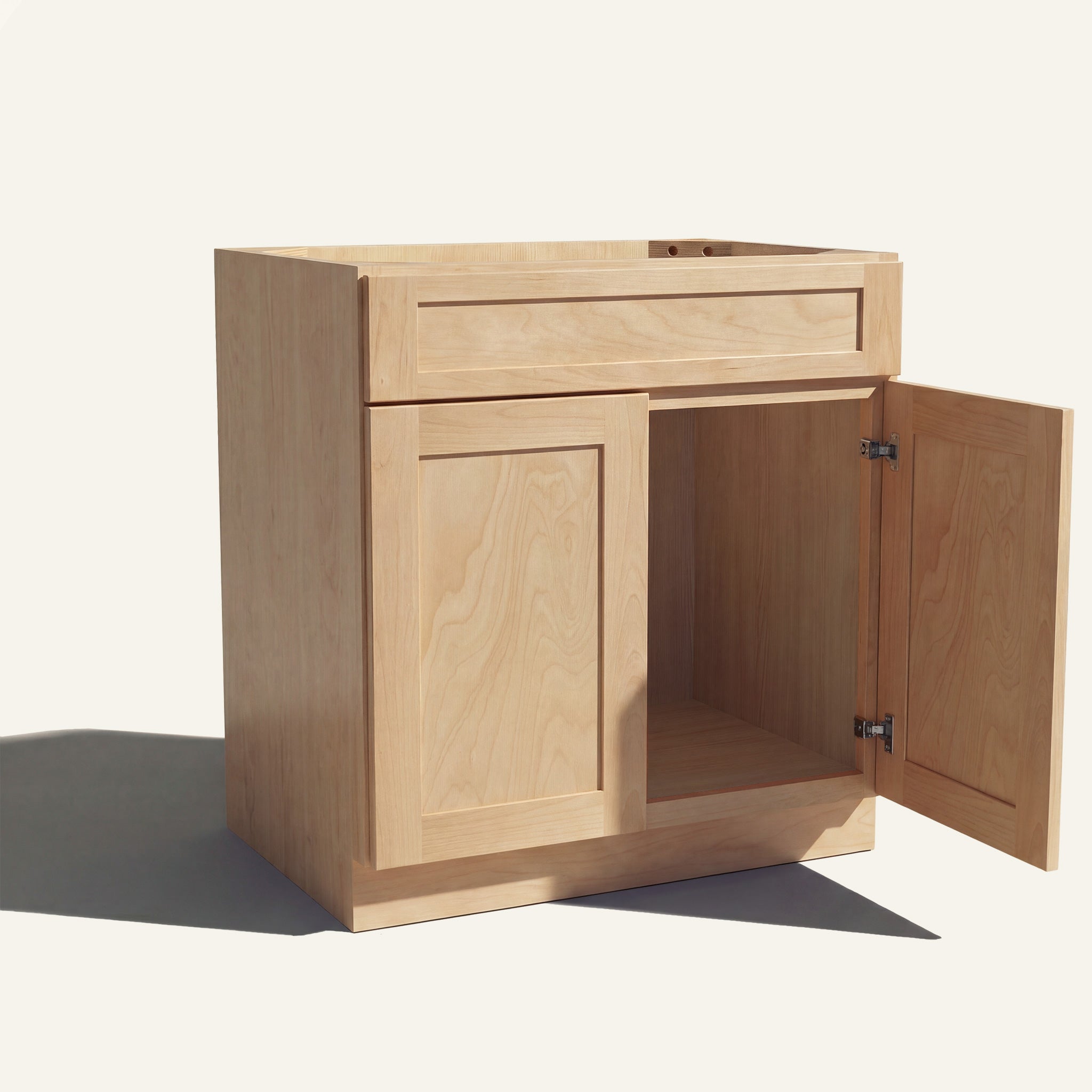 Angled view of natural Seaport Shaker single sink vanity, 1 false front, 2 doors with right one open to a wood interior.