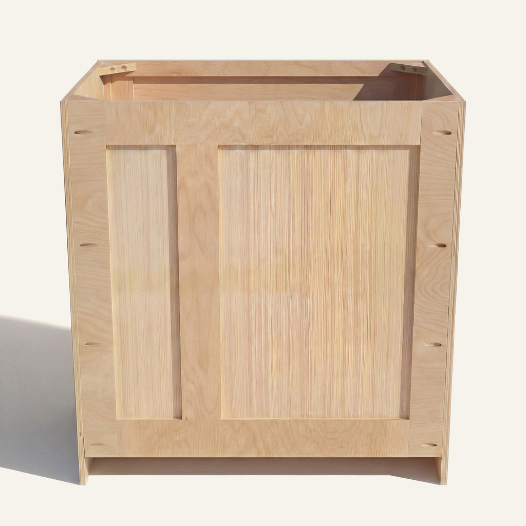 Rear view of a natural Seaport vanity with offset plumbing supports, pocket screw holes, and builder grade plywood construction.