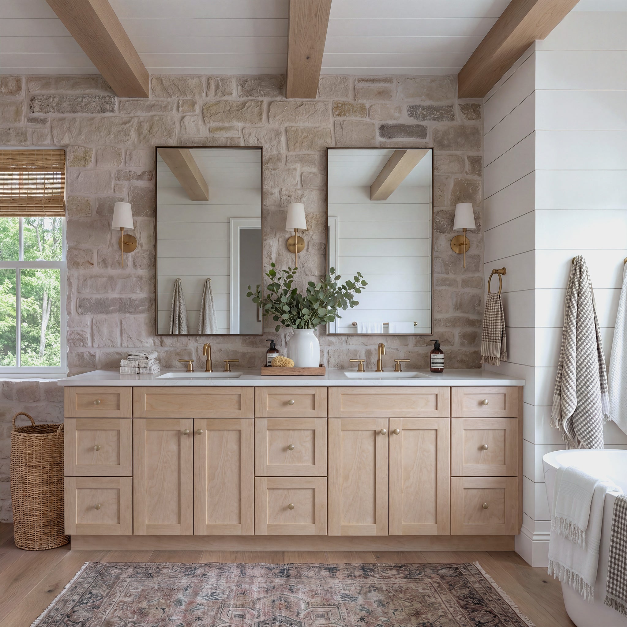 Straight-on view of a natural Seaport double sink vanity flanked by two 3-drawer end cabinets in a warm traditional bathroom.