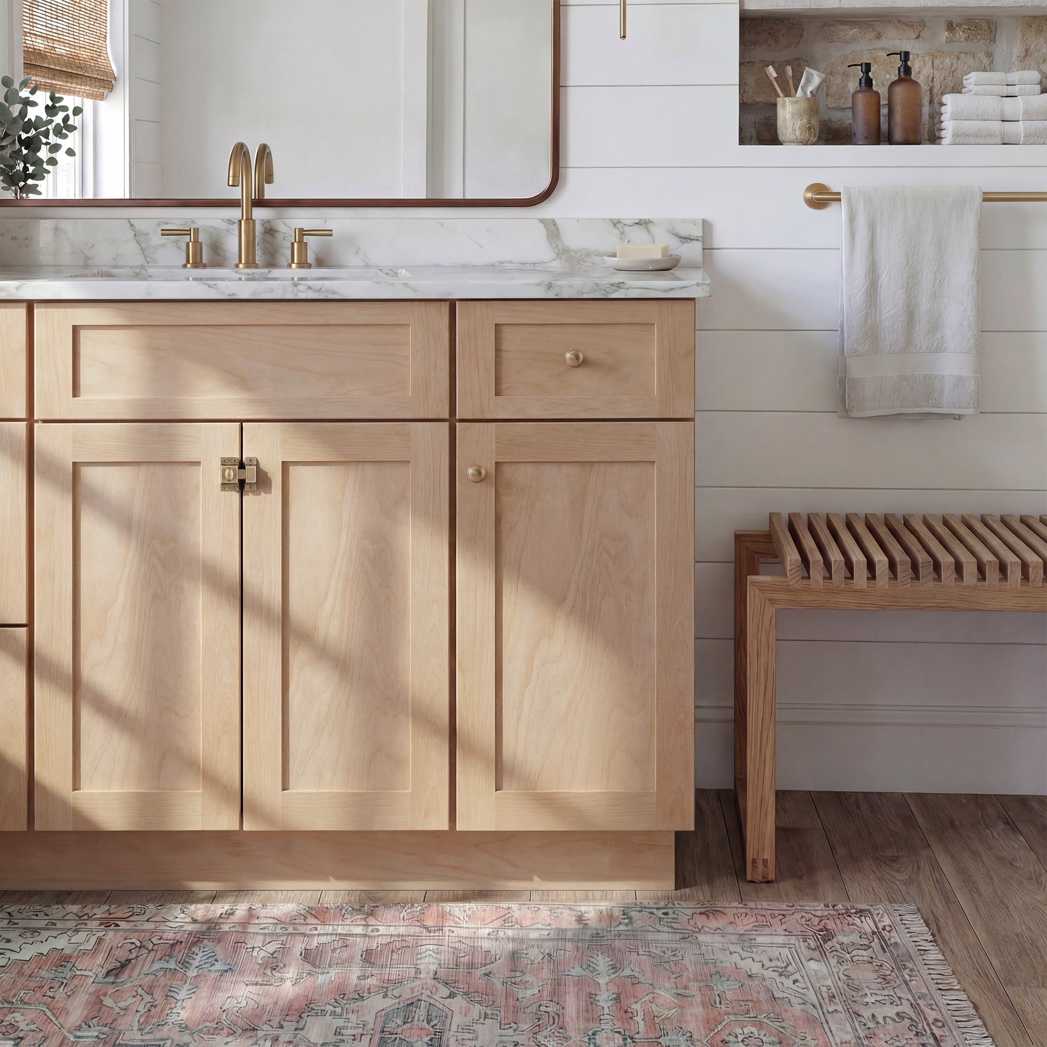 Front view of a natural Seaport shaker vanity with 2 doors, 1 drawer, and 1 false front with a nickel latch in a warm bathroom.