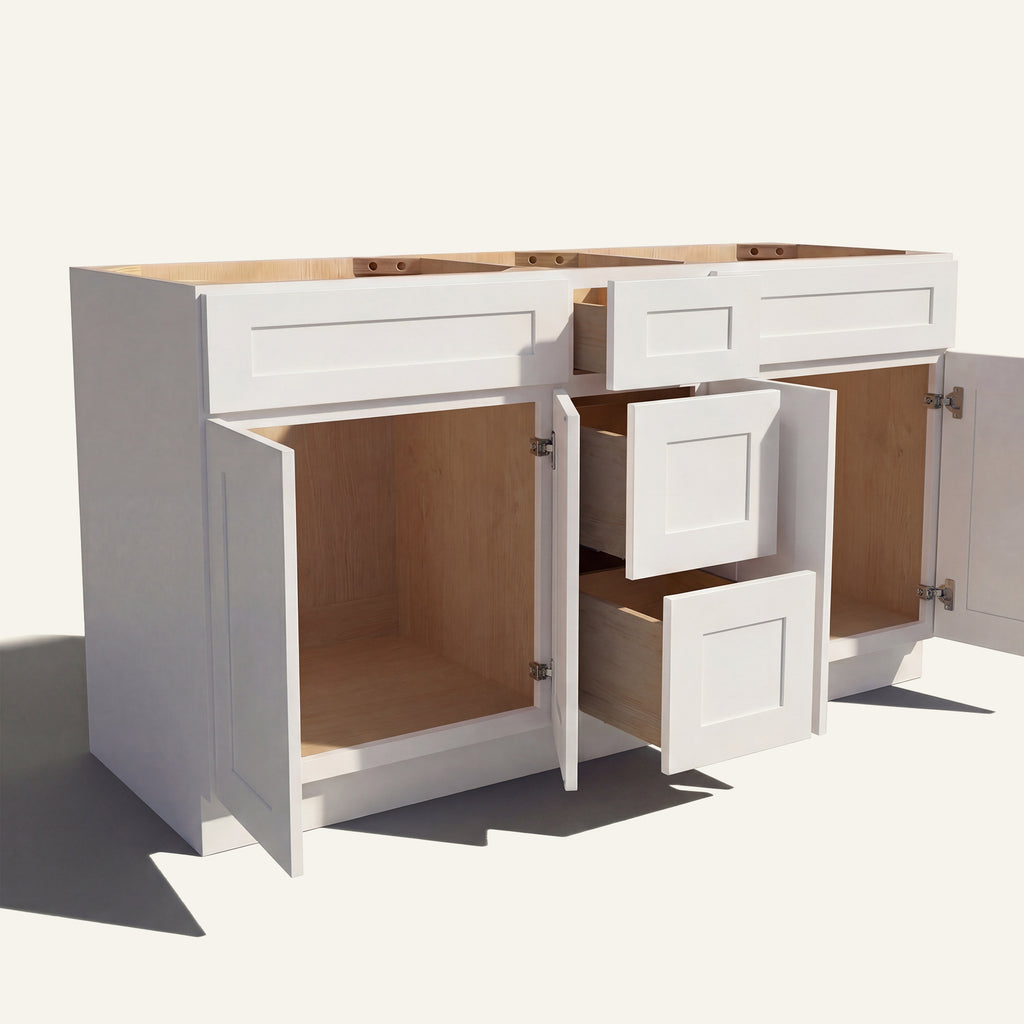 Angled view of a white Seaport Shaker double sink vanity base with doors and 3 drawers open showing wood interior.