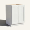 Angled view of a white Seaport Shaker base cabinet with 2 full height doors.