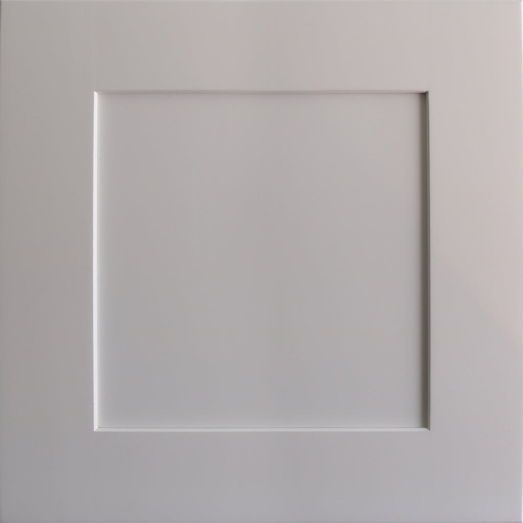 Close up view of a white Seaport shaker cabinet door with a recessed square panel.