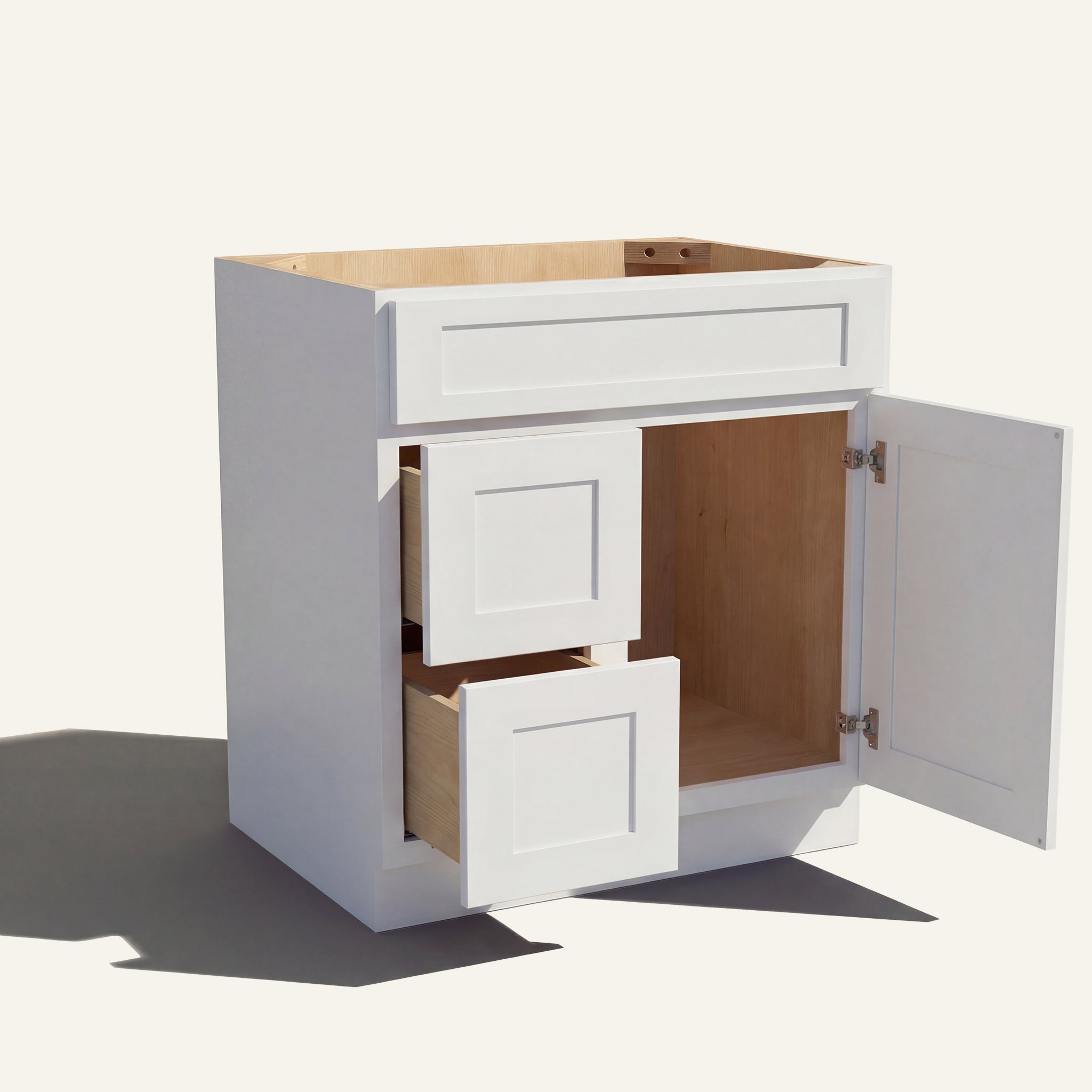 Open view of a white Seaport shaker single sink vanity with 1 door and 2 drawers on the left.