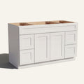 Angled view of a white Seaport Shaker wide single sink vanity base with 2 doors, 4 drawers, and 1 false drawer front.