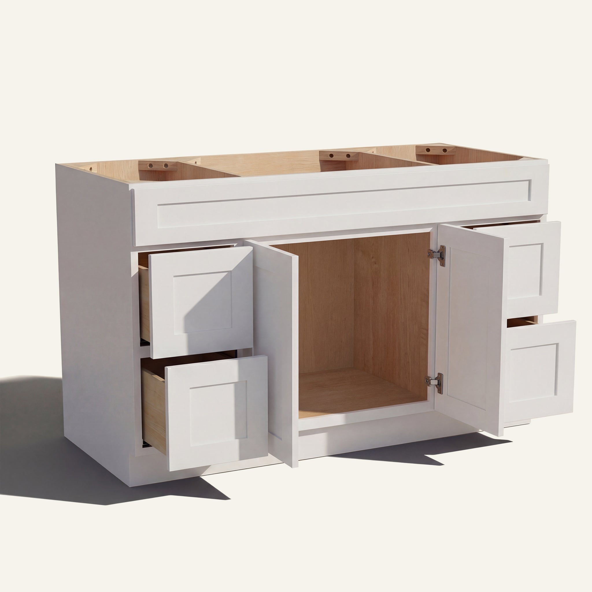 Open view of a white Seaport Shaker single sink vanity base with 2 doors and 4 drawers showing the stained interior.