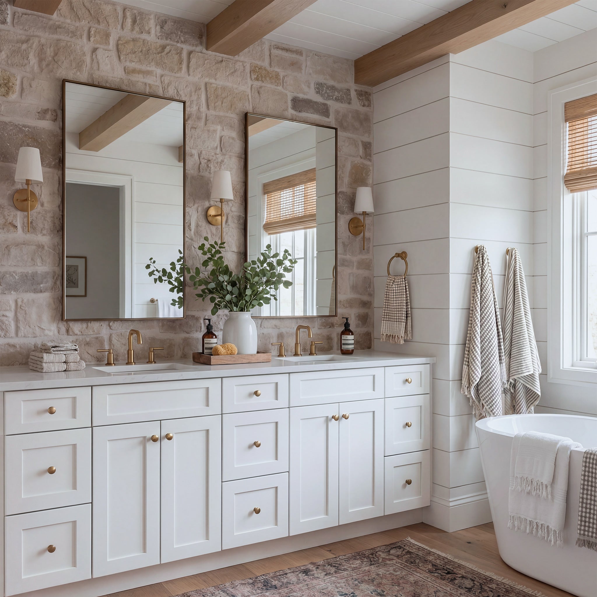 Angled view of a white Seaport shaker double sink vanity in a traditional, warm bathroom scene with a marble countertop.